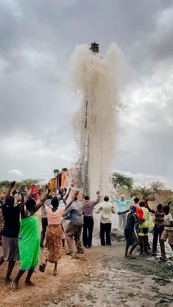 Community Celebrating Borehole Water